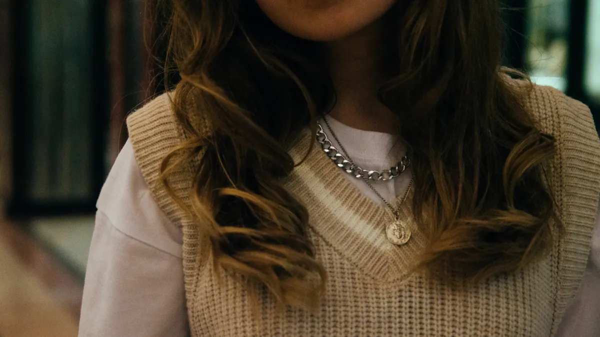 Woman wearing layered necklaces