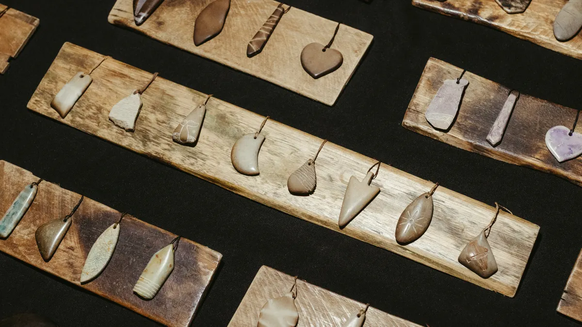Necklace pendants and pendant styles — The Complete Guide Assorted gemstone pendants displayed on boards