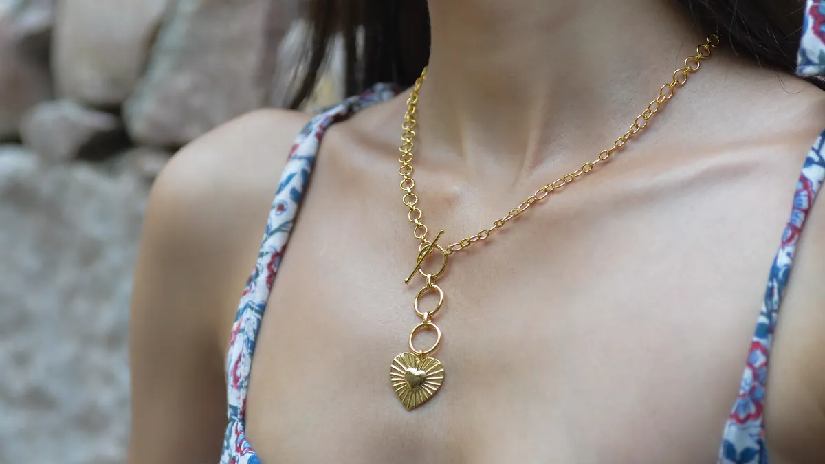 Gold necklace with a small heart pendant